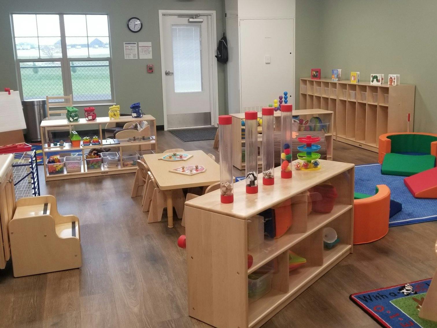Classroom filled with child-sized furniture and toys