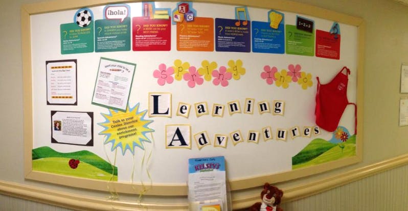 bulletin board with the words "Spring into Learning Adventures"