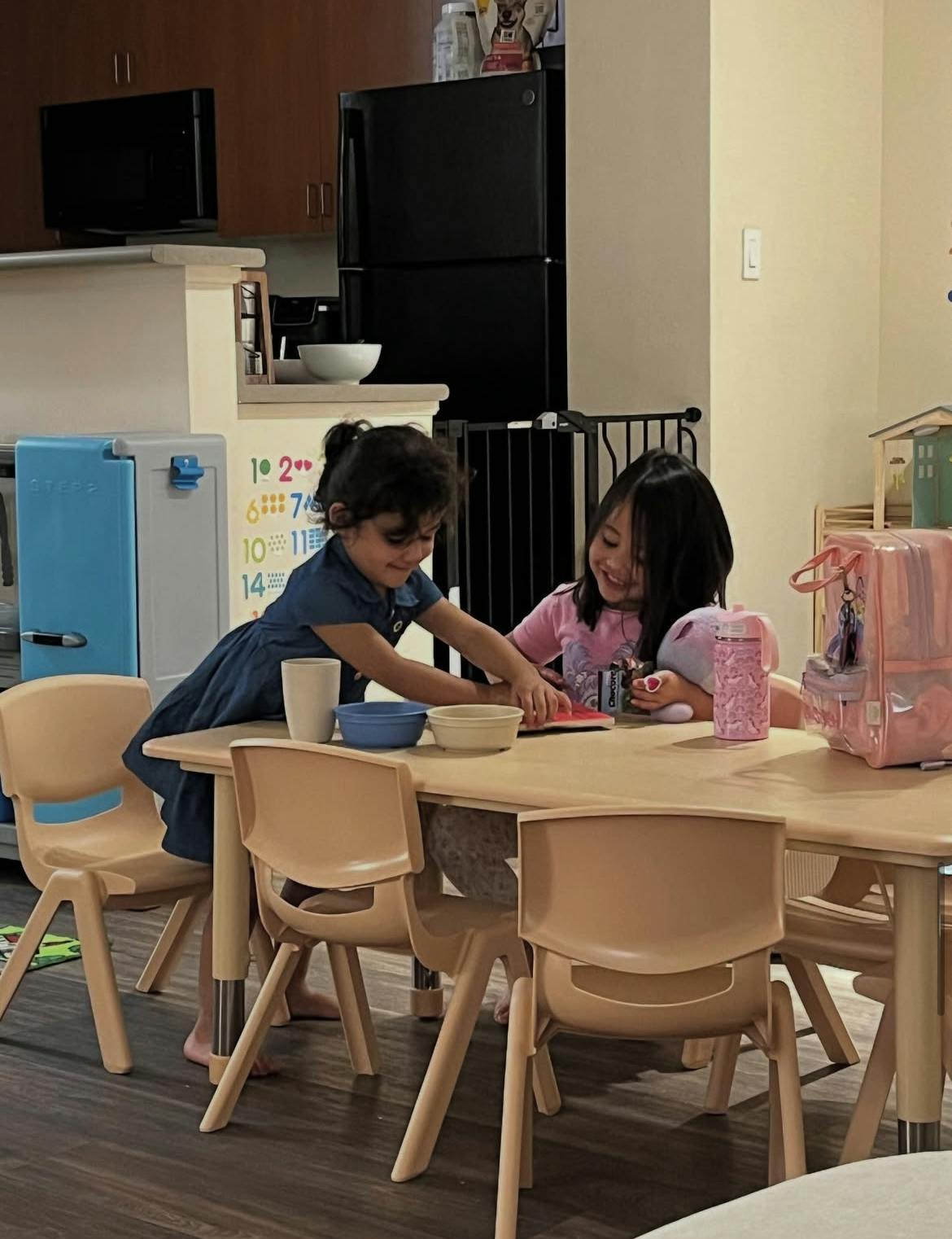 Two children playing at a table