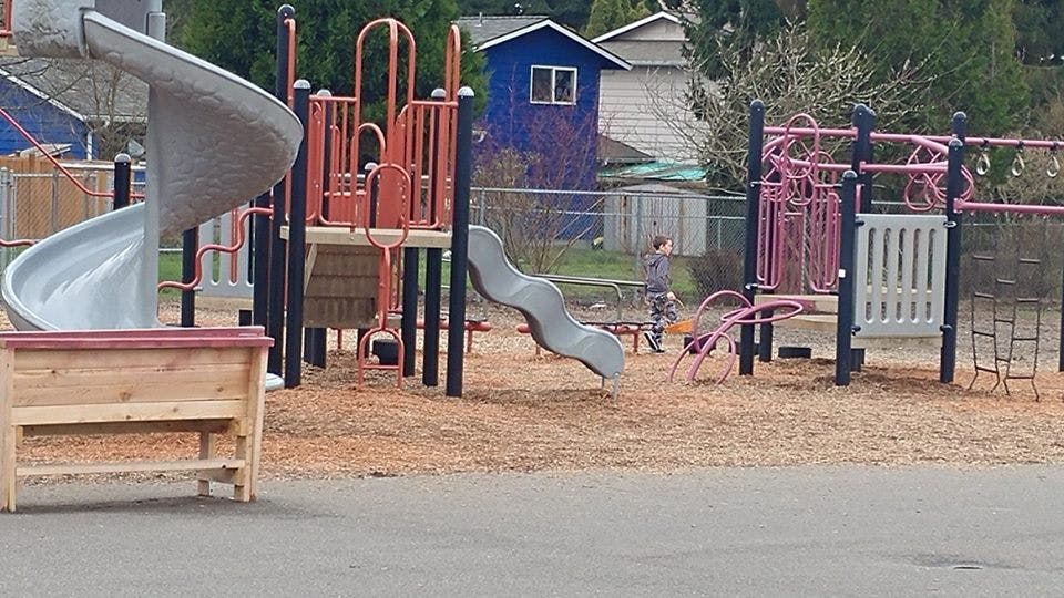 Playground with slides and climbing structures