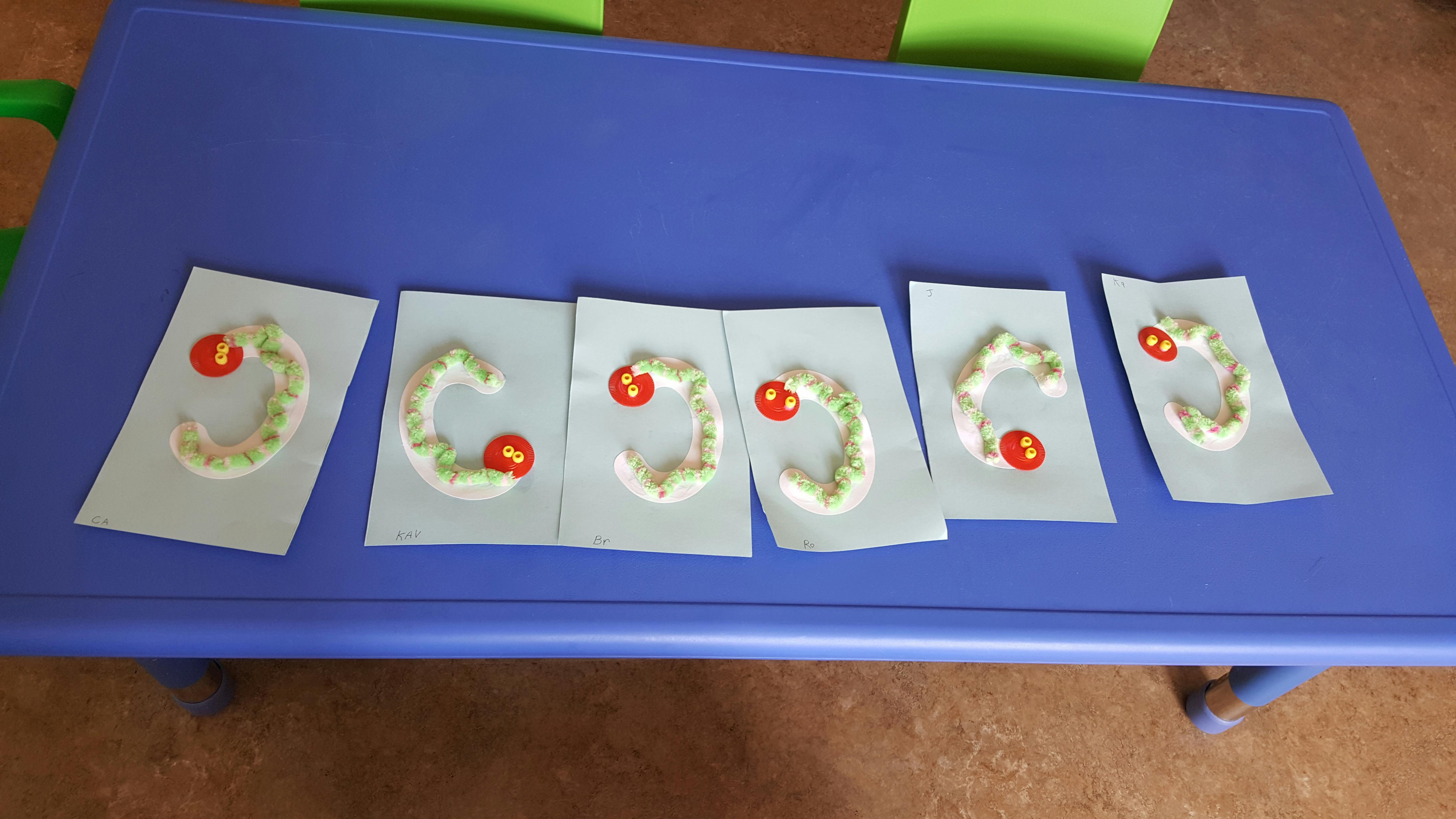 Crafted letters on paper on a blue table