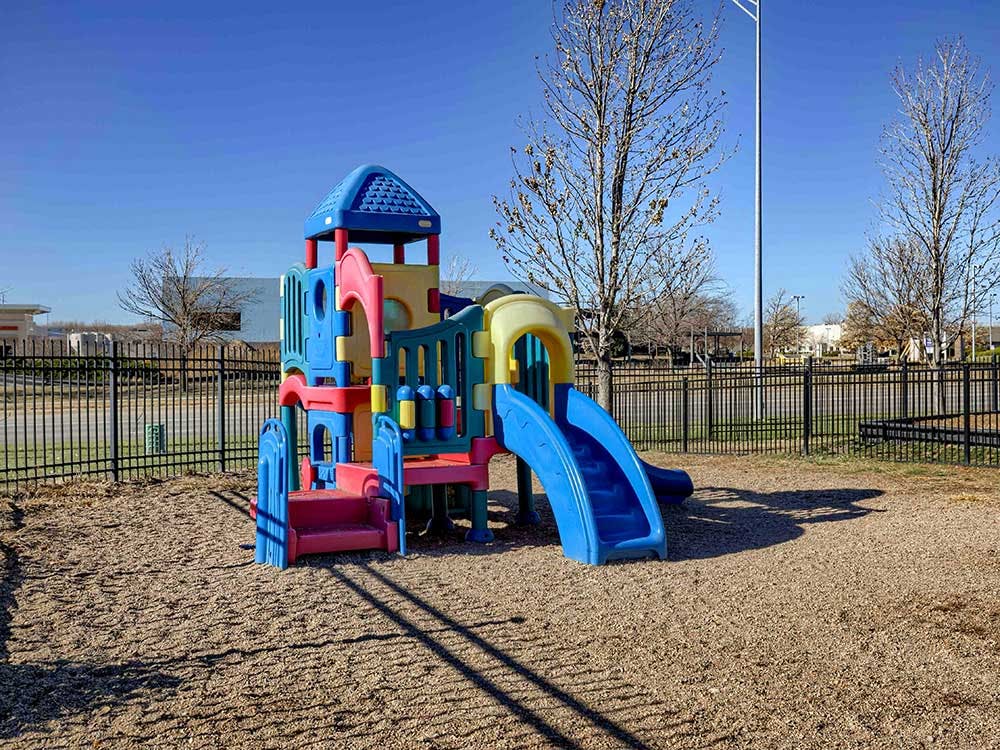 Colorful playground structure on a wood chip surface