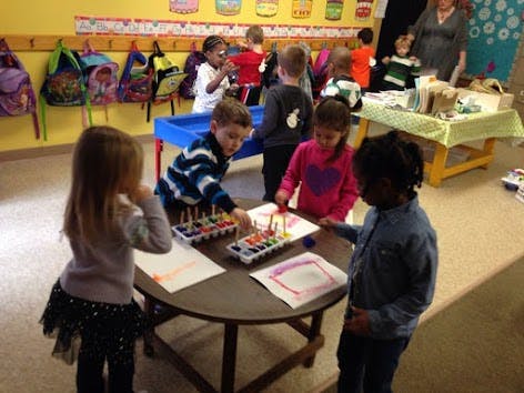 Children doing an art activity in a classroom