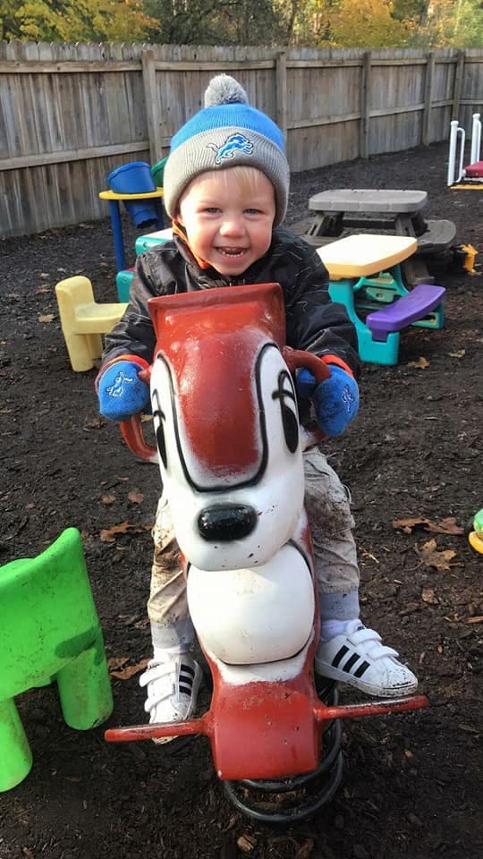 Child on a spring rider in a playground