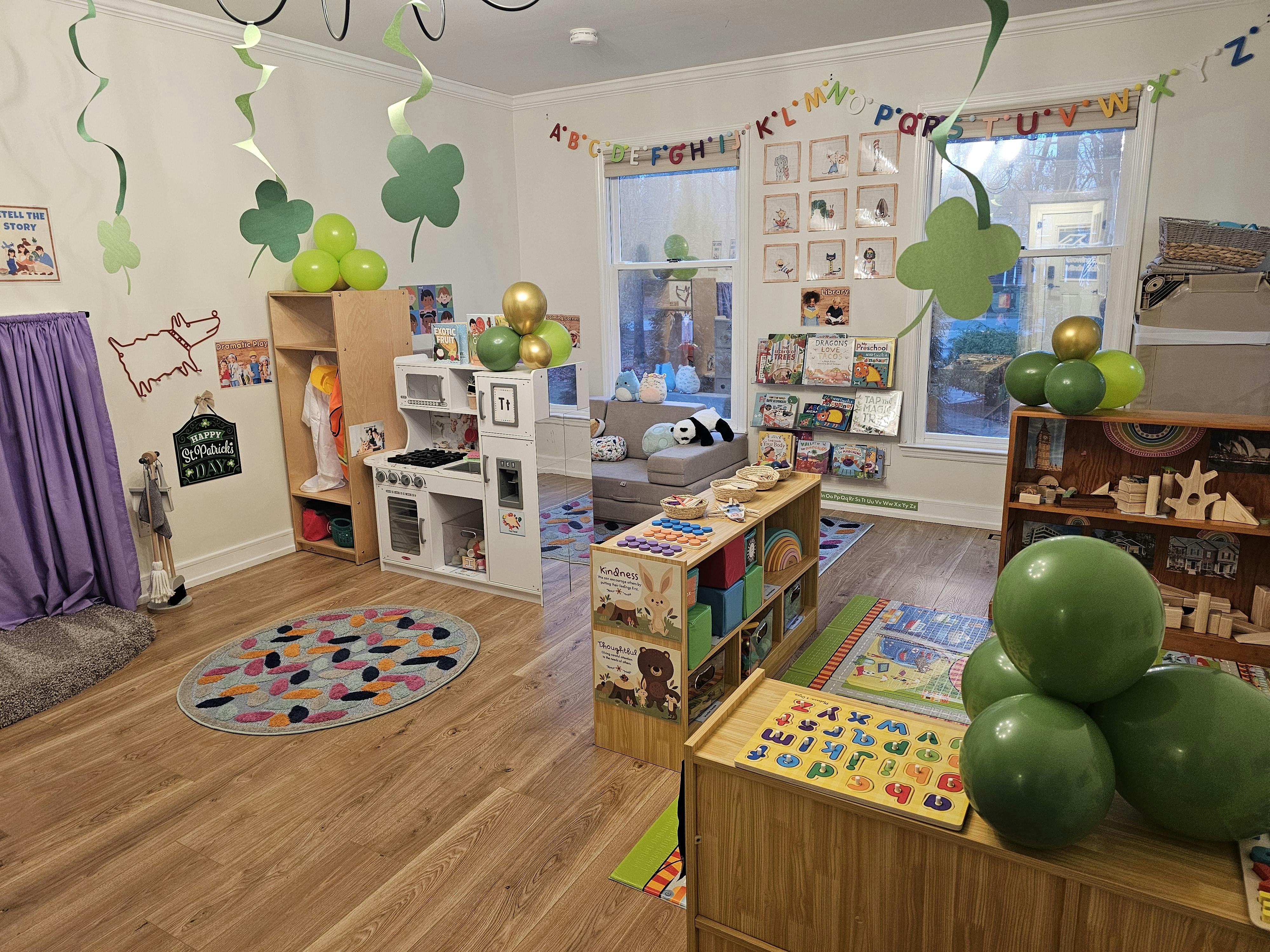 Playroom with toys, shelves, and green decorations