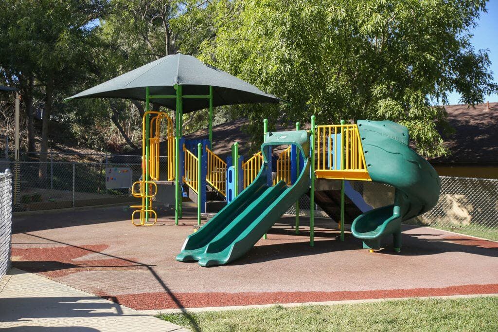 Empty playground with slides and climbing structures
