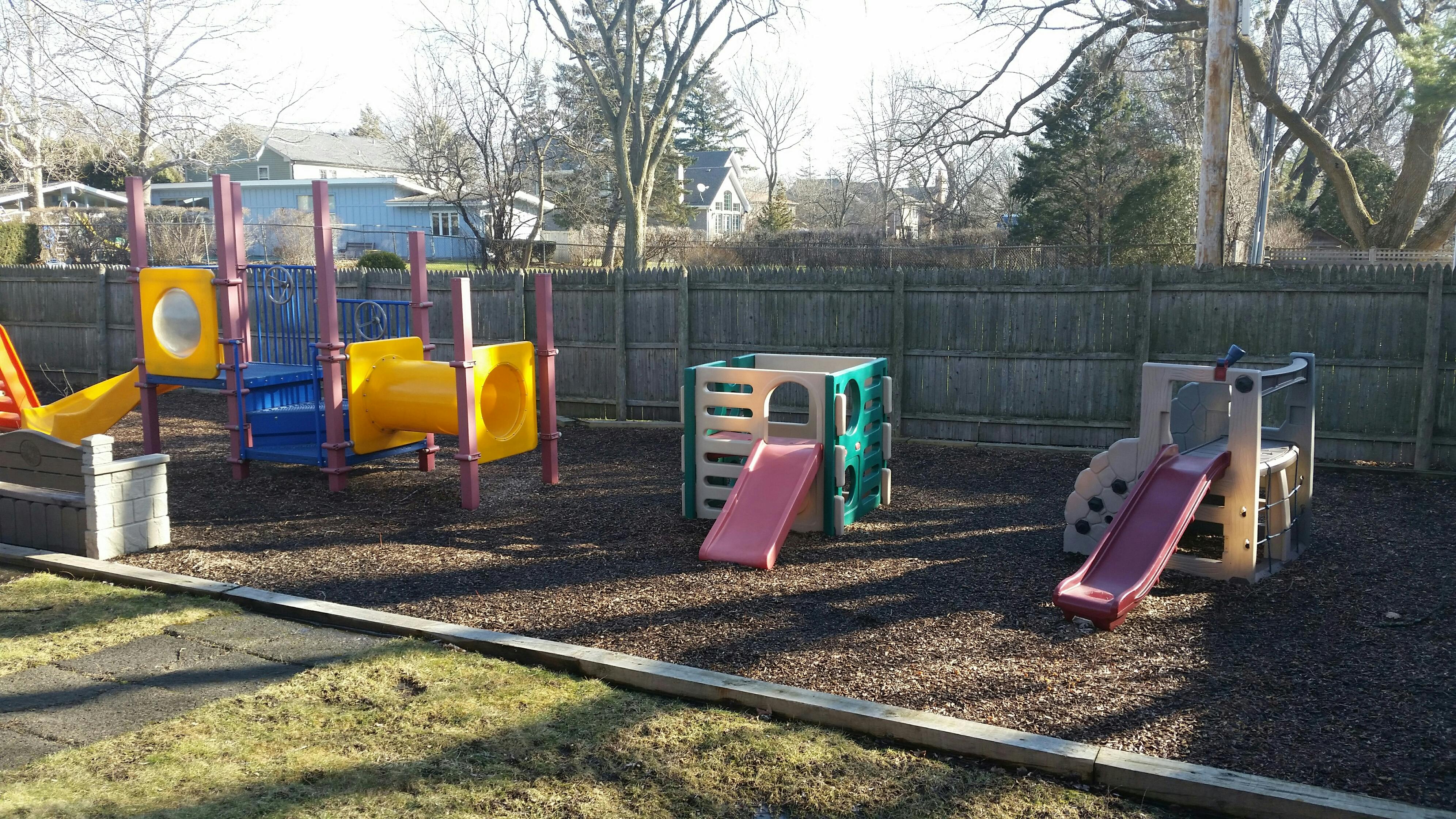 Playground with multiple slides and climbing structures