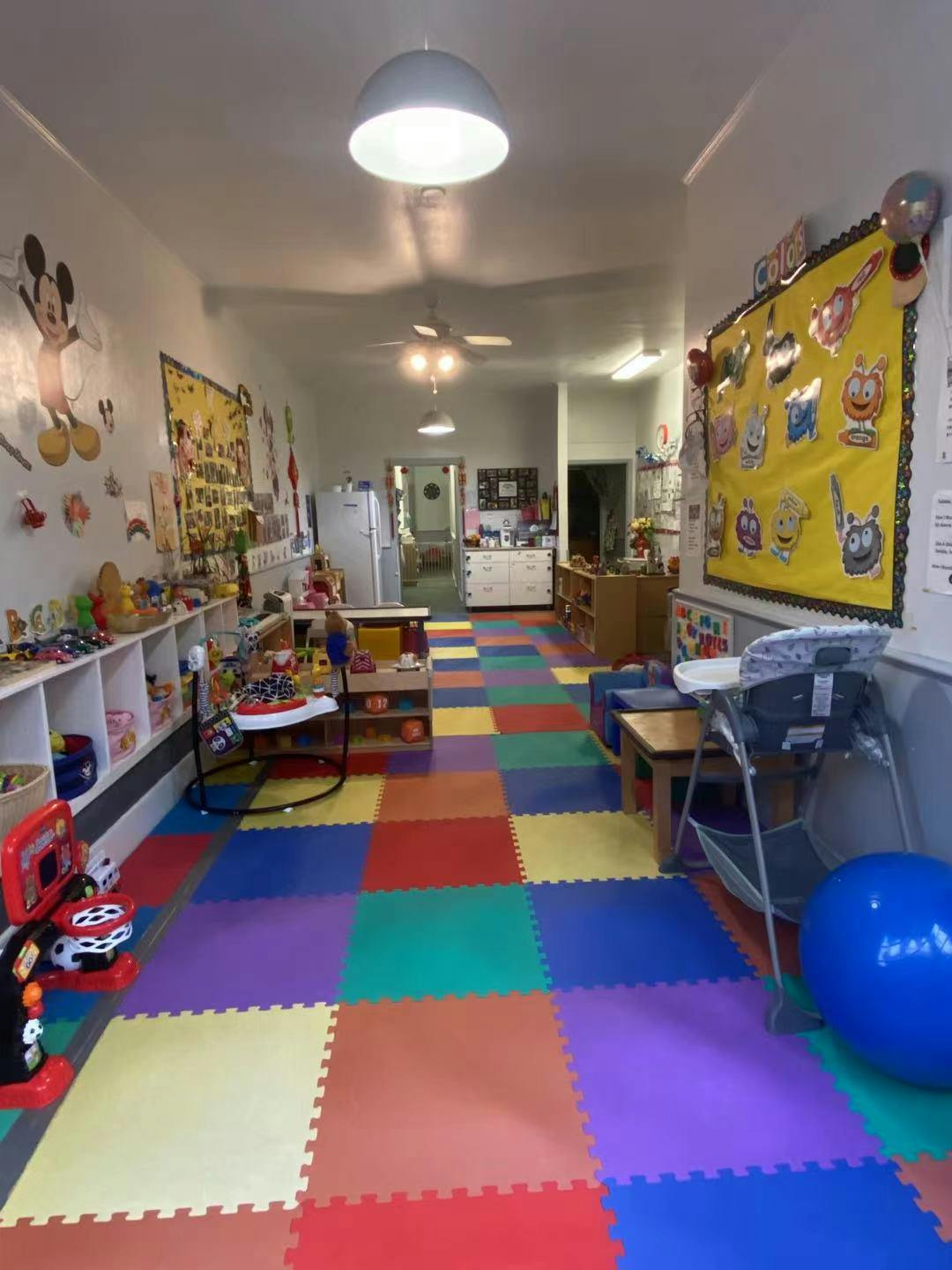 Playroom with colorful floor mats and toys