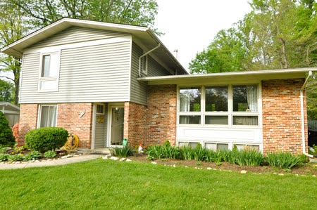 Split-level house with brick and siding exterior