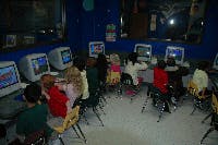 Children sitting at computers in a classroom