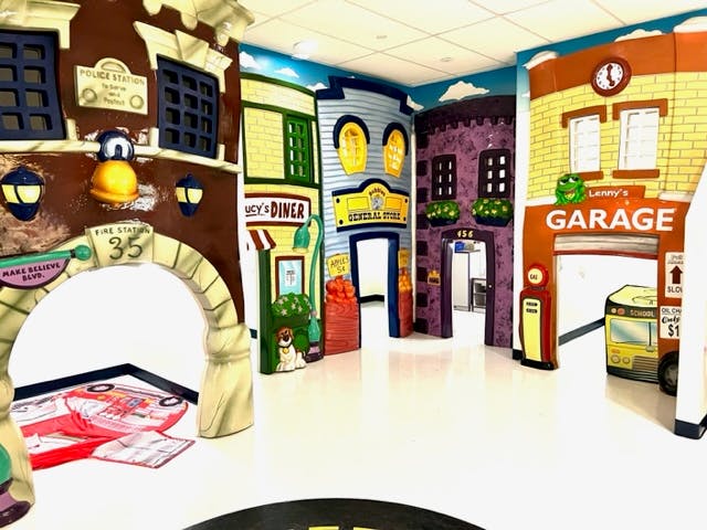 Indoor play area with colorful building facades