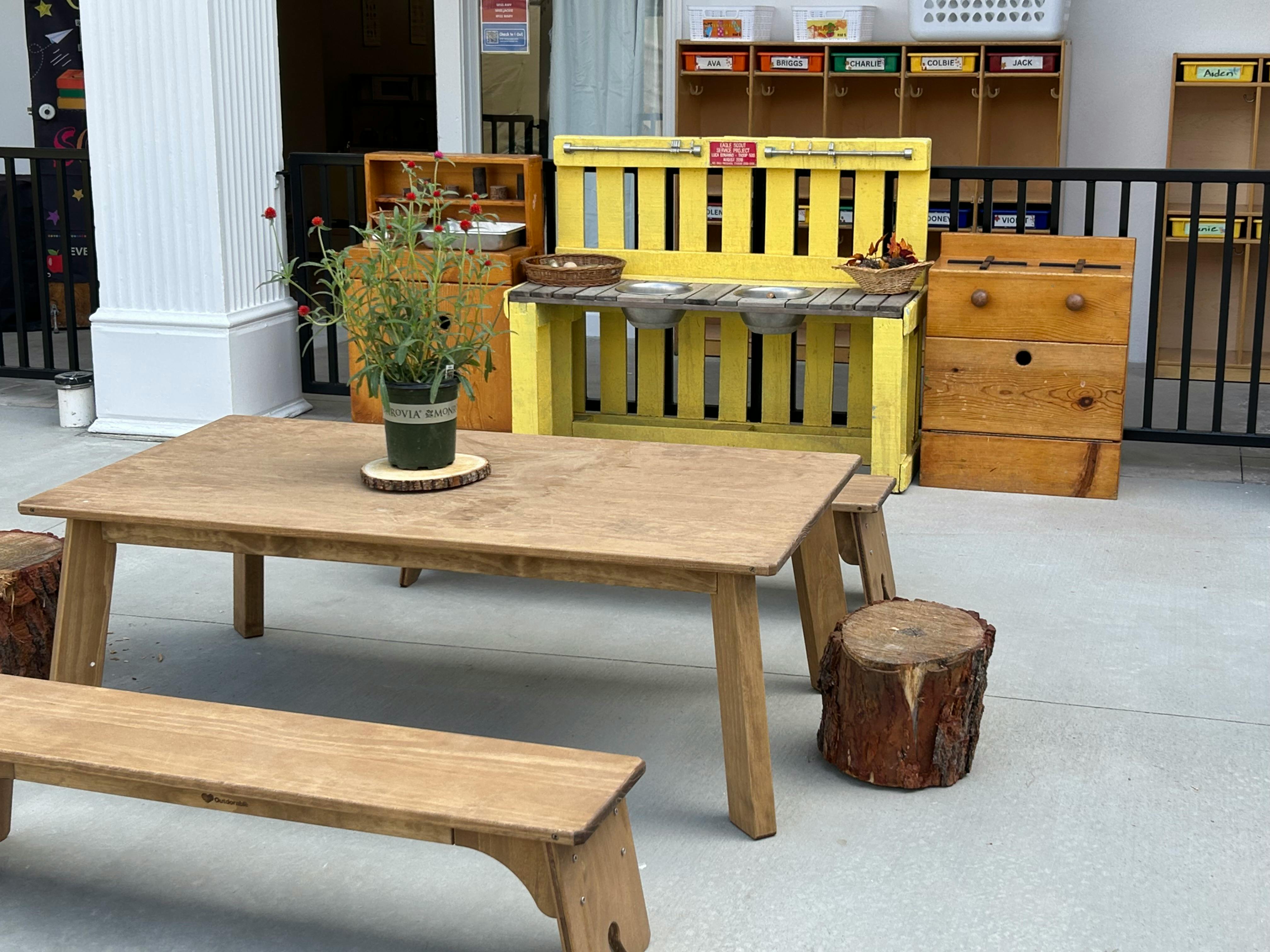 Wooden outdoor play furniture and seating area for children