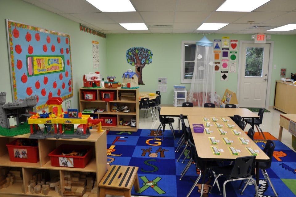 Classroom with tables, chairs, and toys