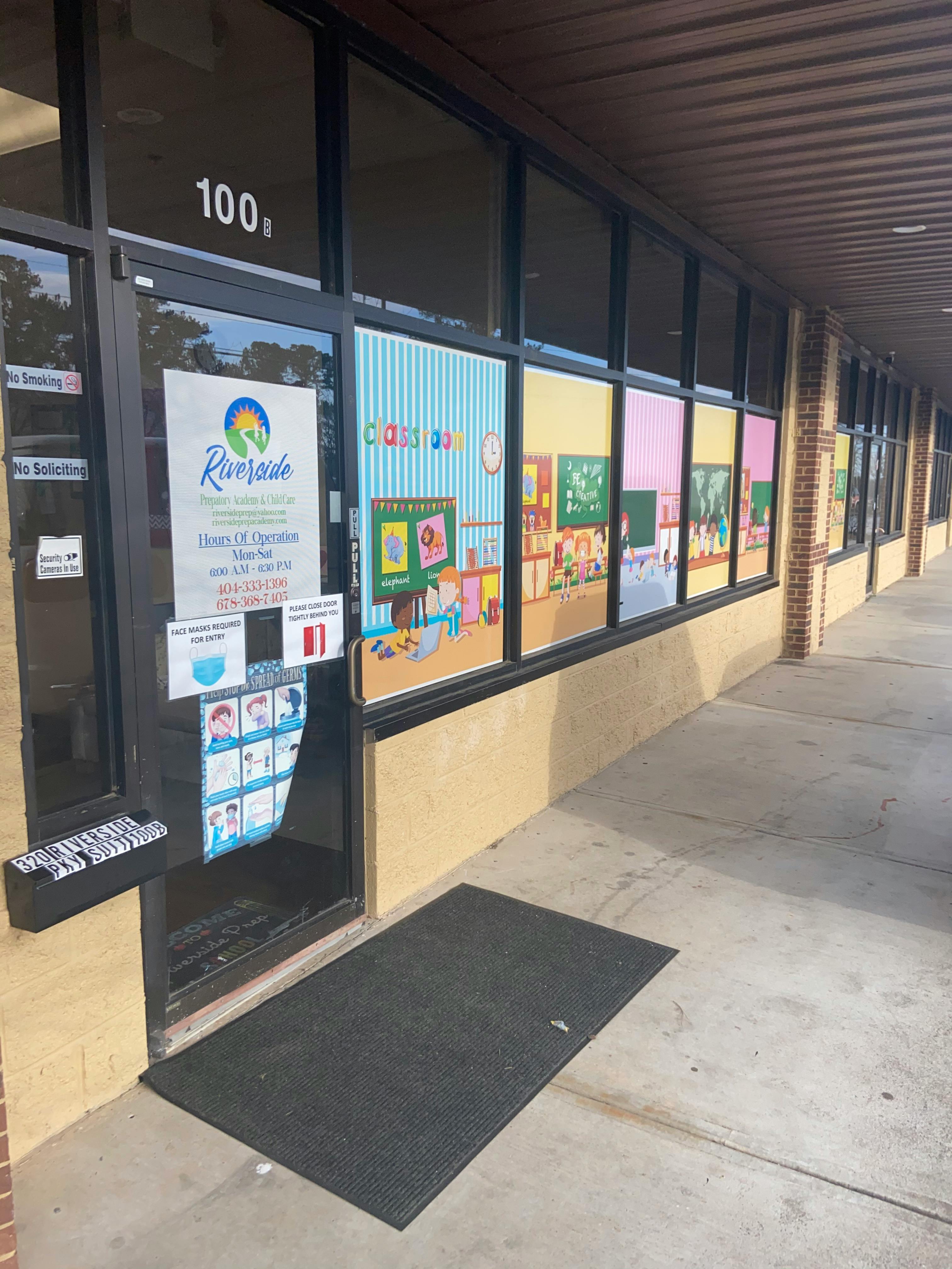 Storefront with a sign on the door and colorful window displays