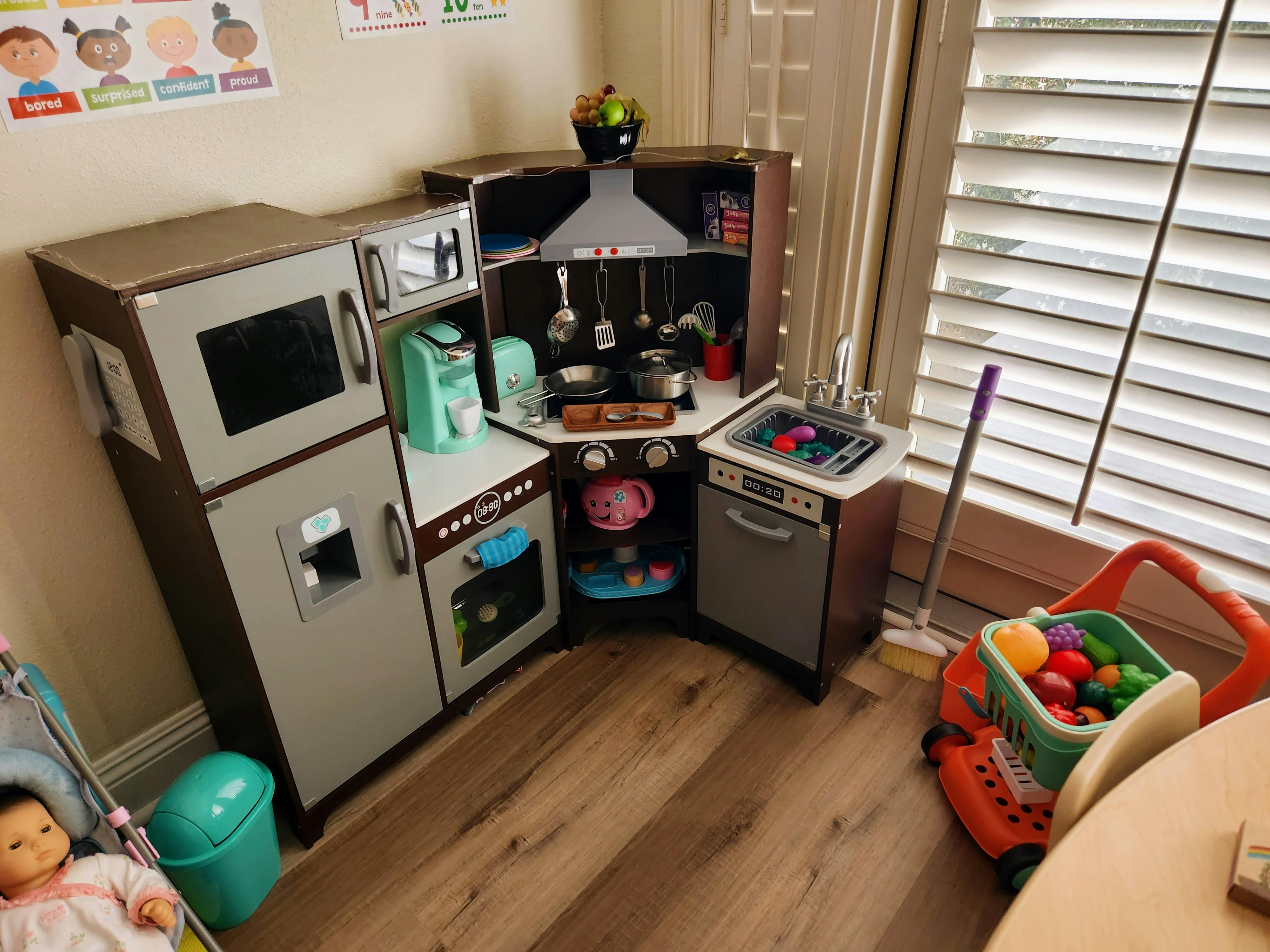 Child's play kitchen set with appliances and accessories