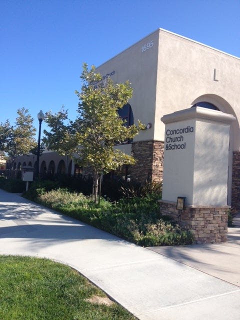 Building with "Concordia Church & School" sign
