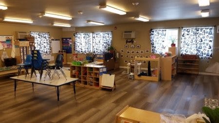 Empty classroom with tables and chairs