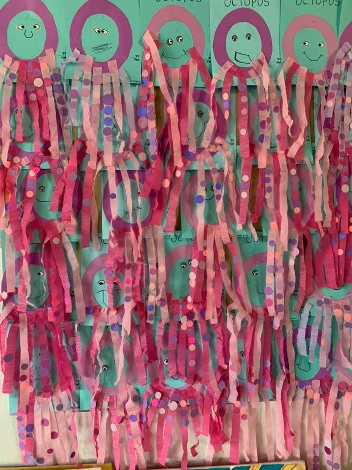 Children's craft project of paper octopuses with ribbon tentacles