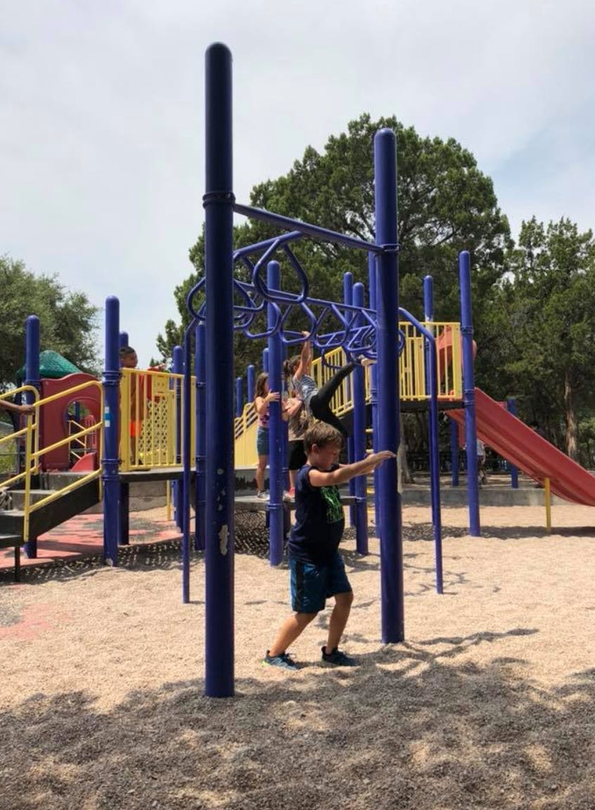Children playing on a playground structure