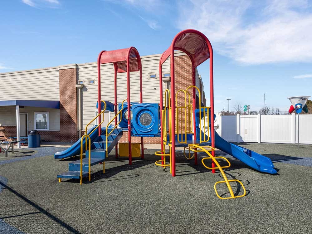 A colorful playground with slides and climbing structures