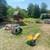 Person on a lawnmower cutting grass