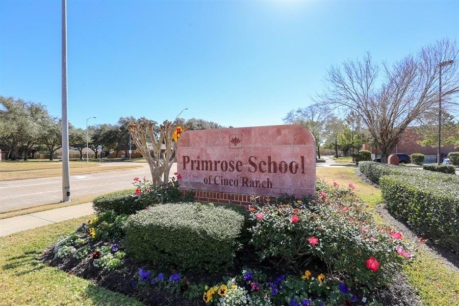 Primrose School at Cinco Ranch sign in a landscaped garden