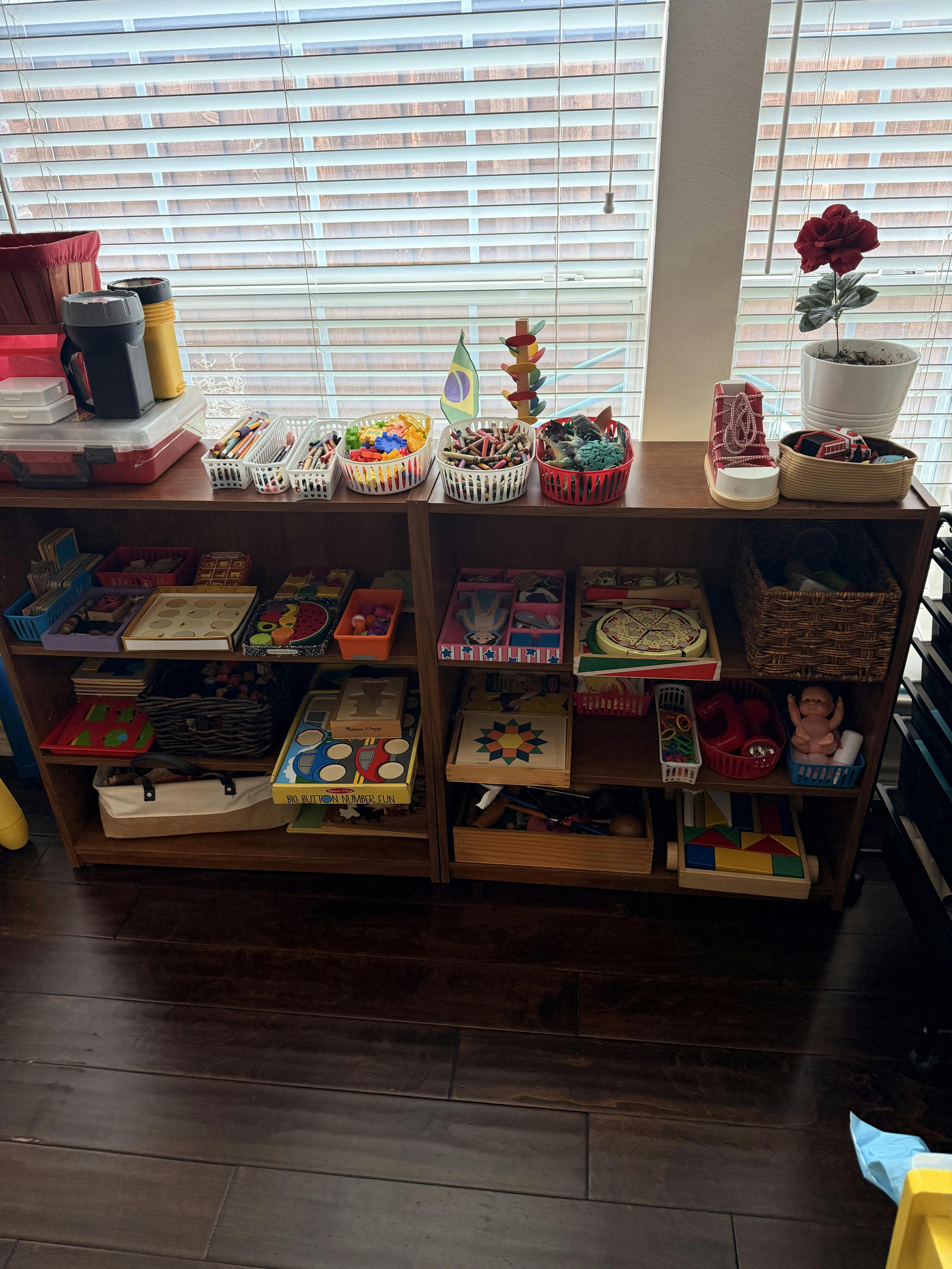 Shelves filled with various toys and learning materials