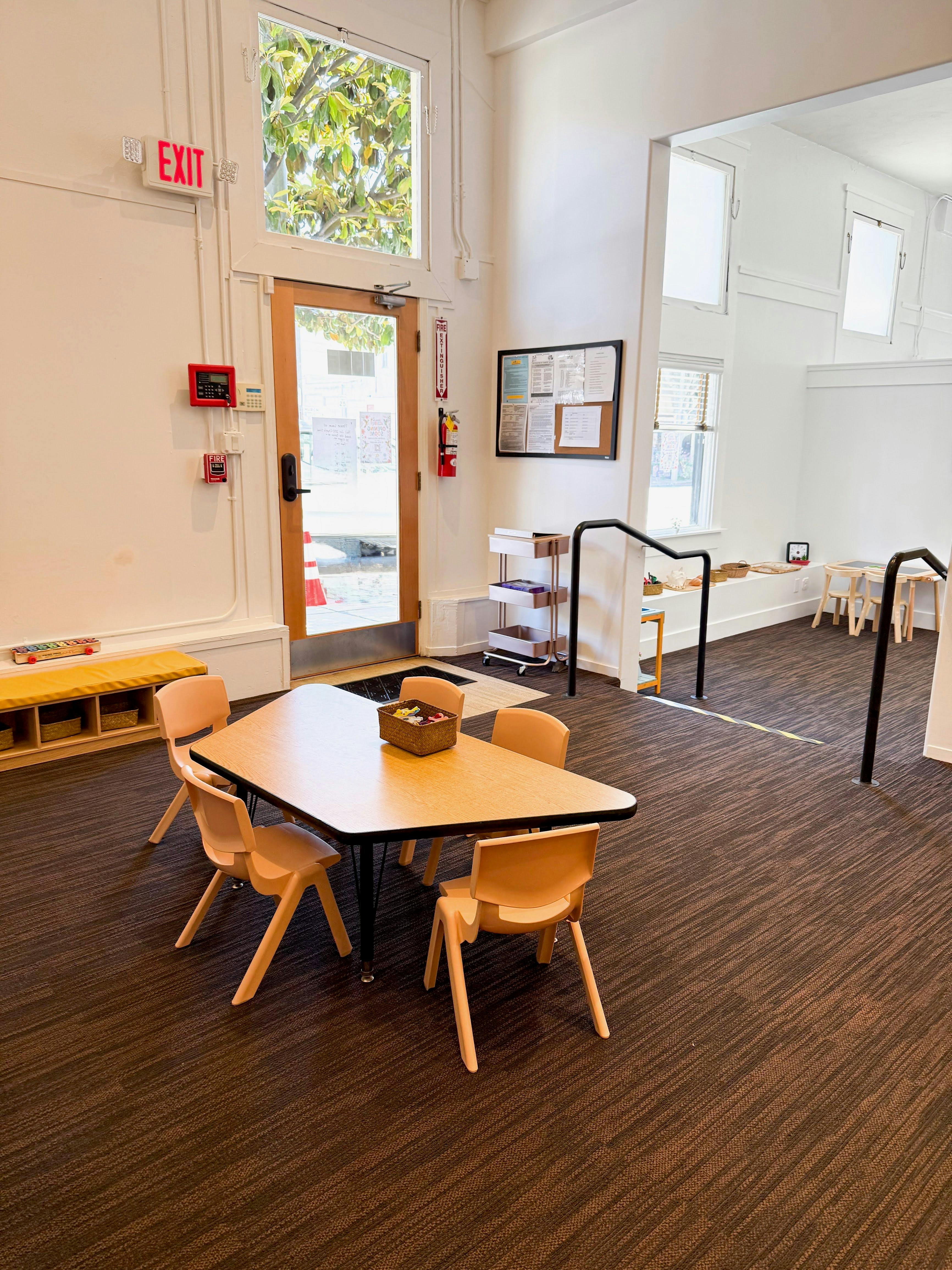 Small table with four chairs in a classroom setting