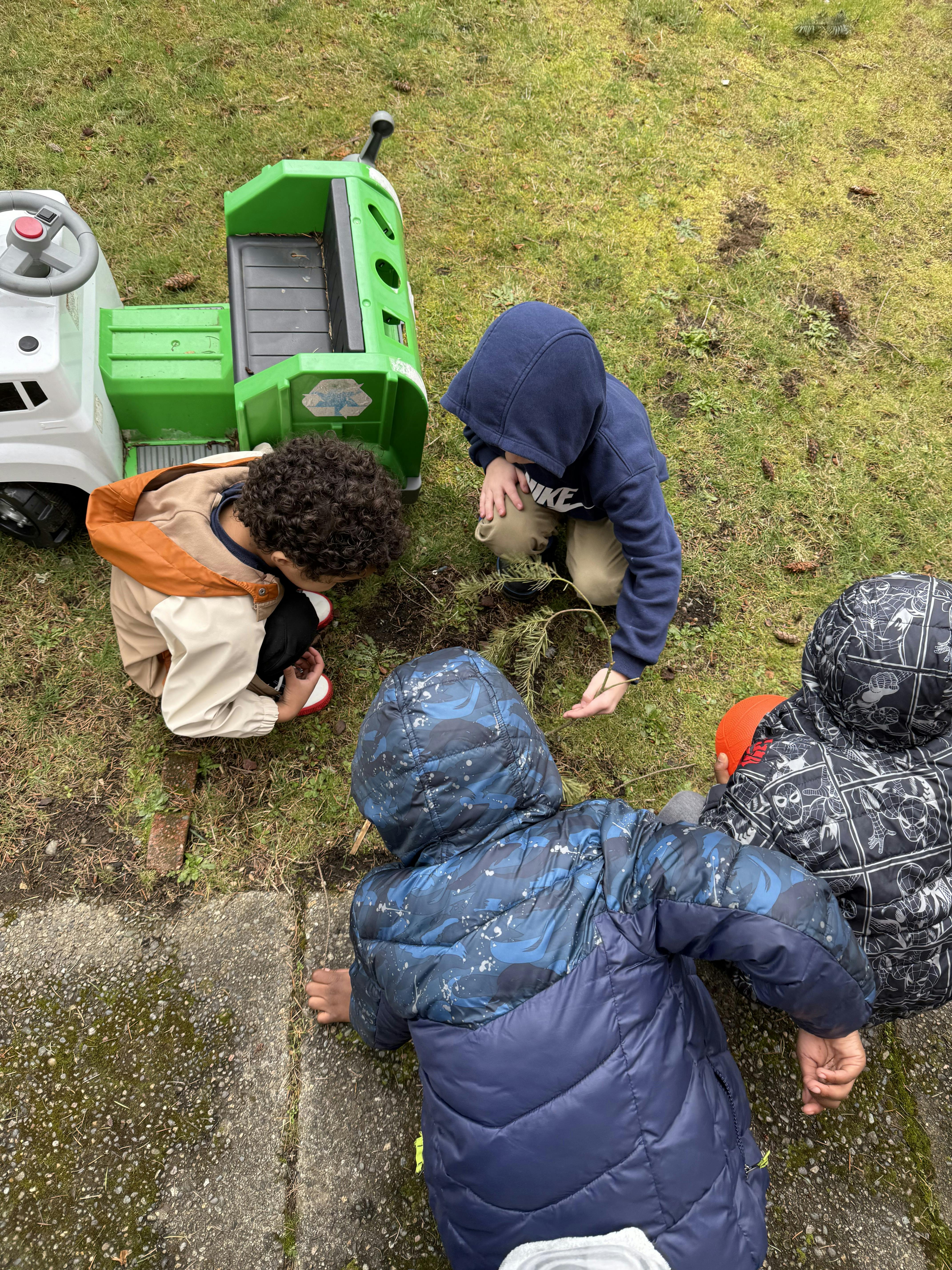Children playing outdoors on grass