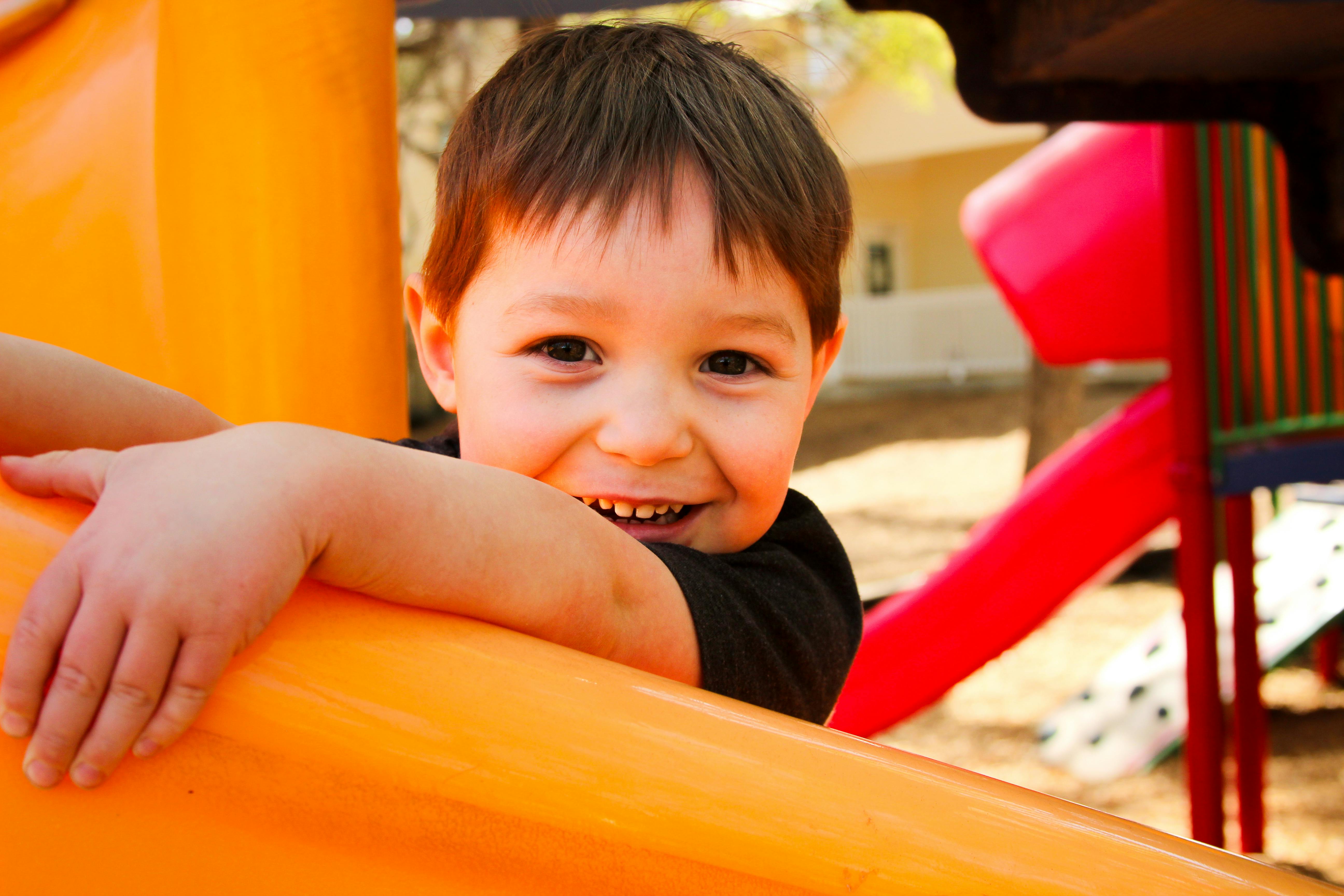 Child on a playground slide