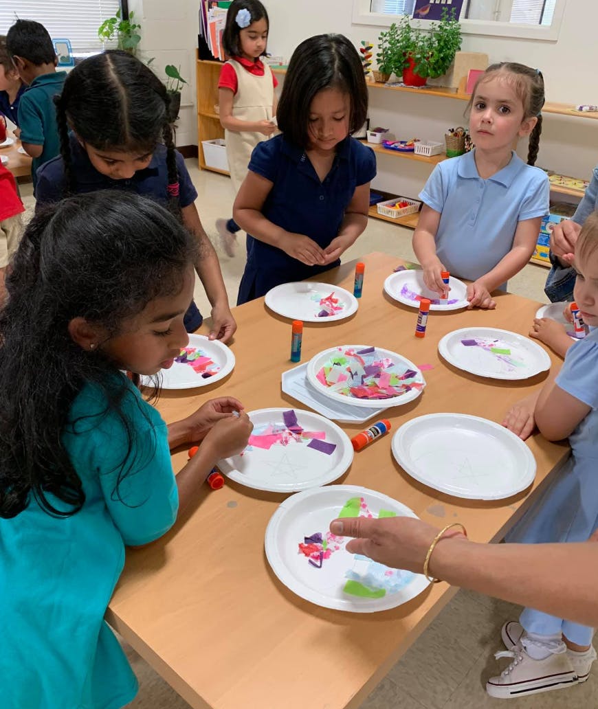 Children doing crafts at a table
