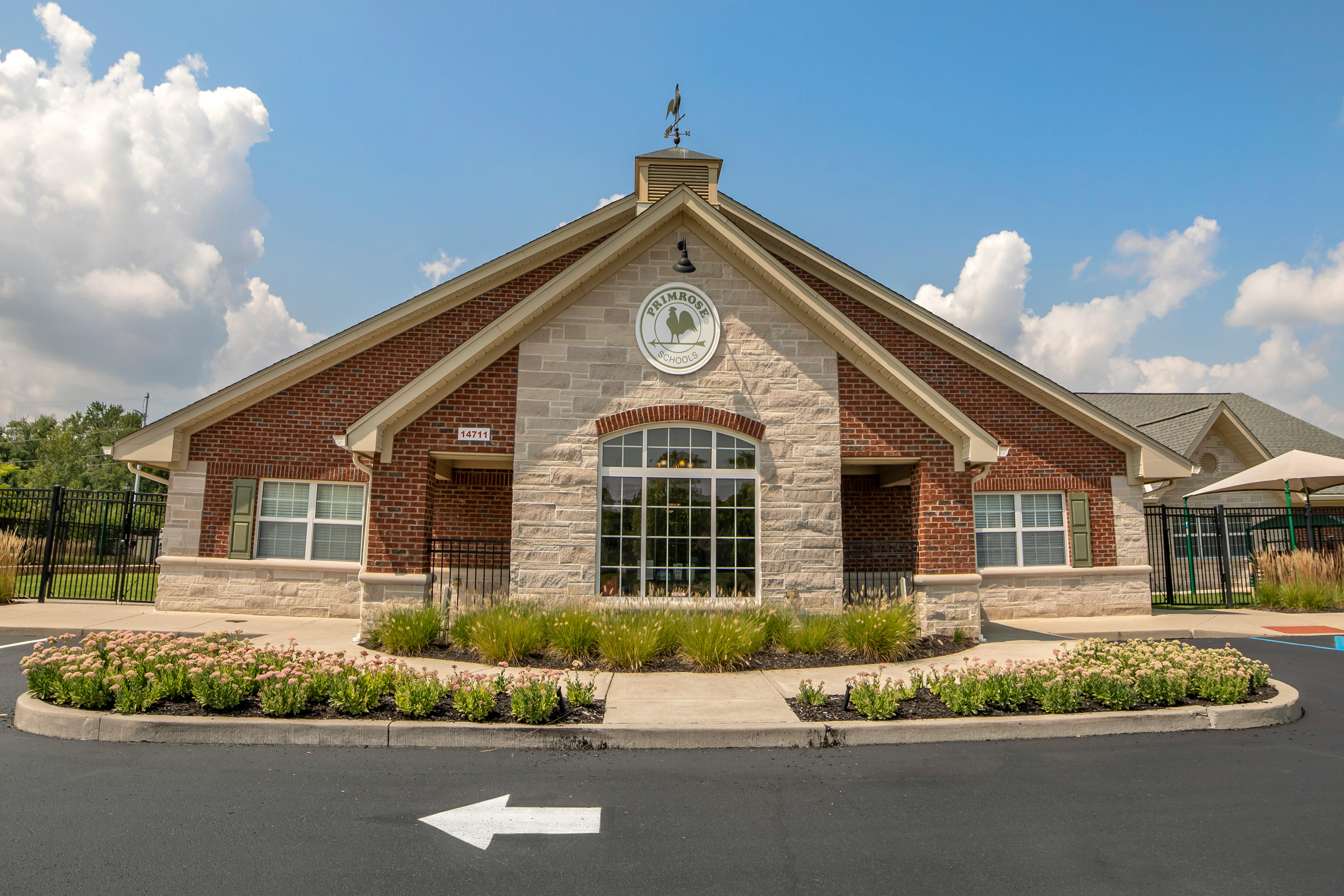 Primrose Schools building exterior with brick, stone, and "Primrose Schools" sign