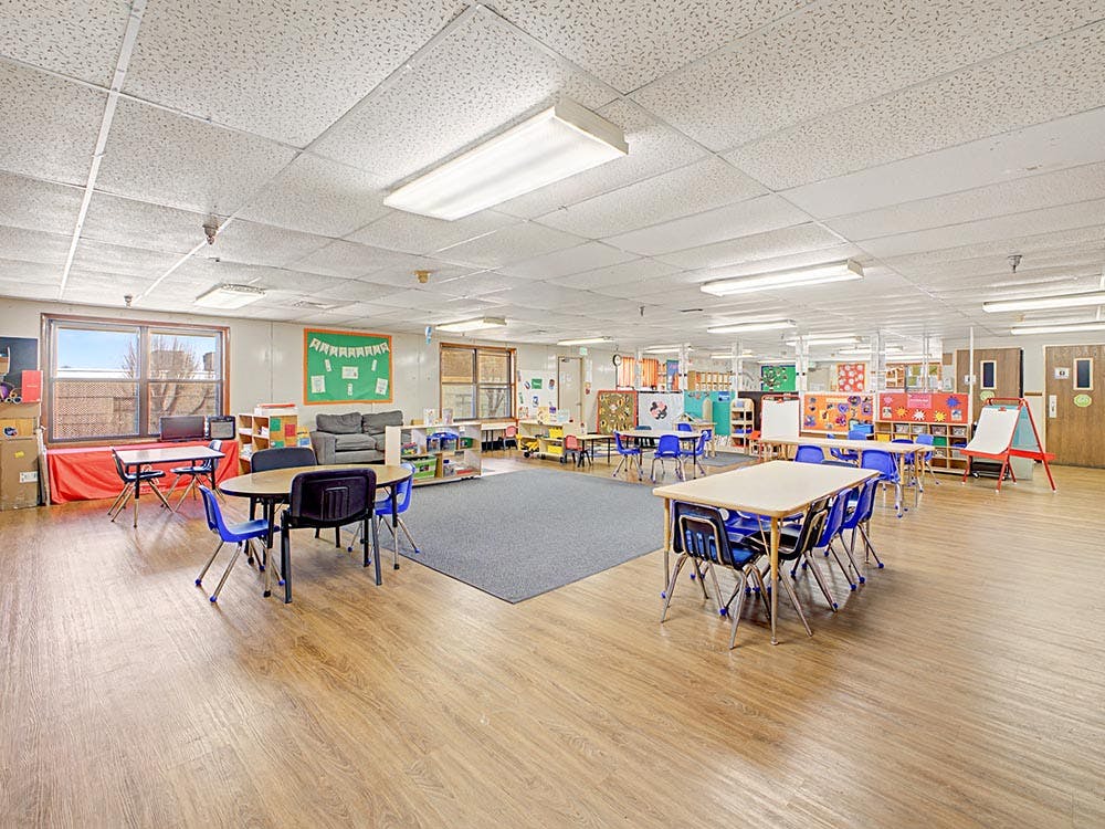 Classroom with child-sized tables and chairs