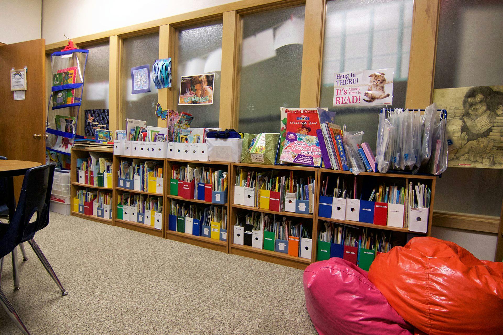 Bookshelves filled with books in a classroom