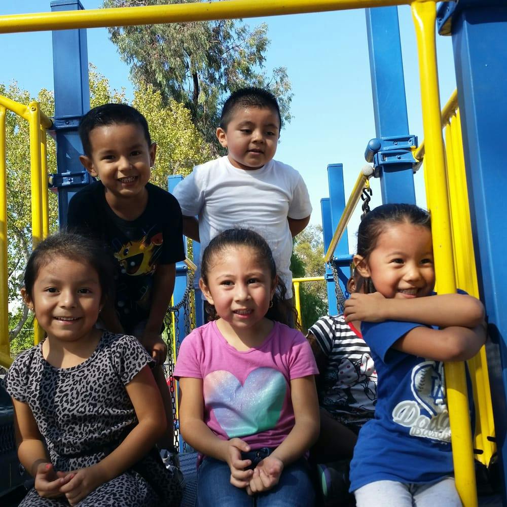 Five children on a playground structure