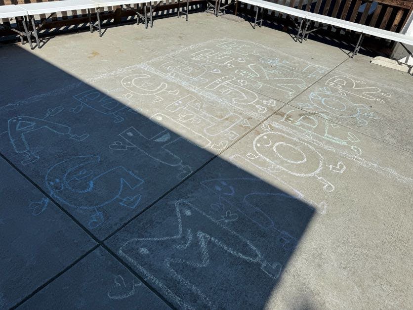 Chalk drawings on concrete pavement