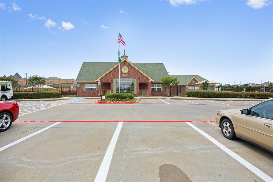 Building with an American flag in a parking lot