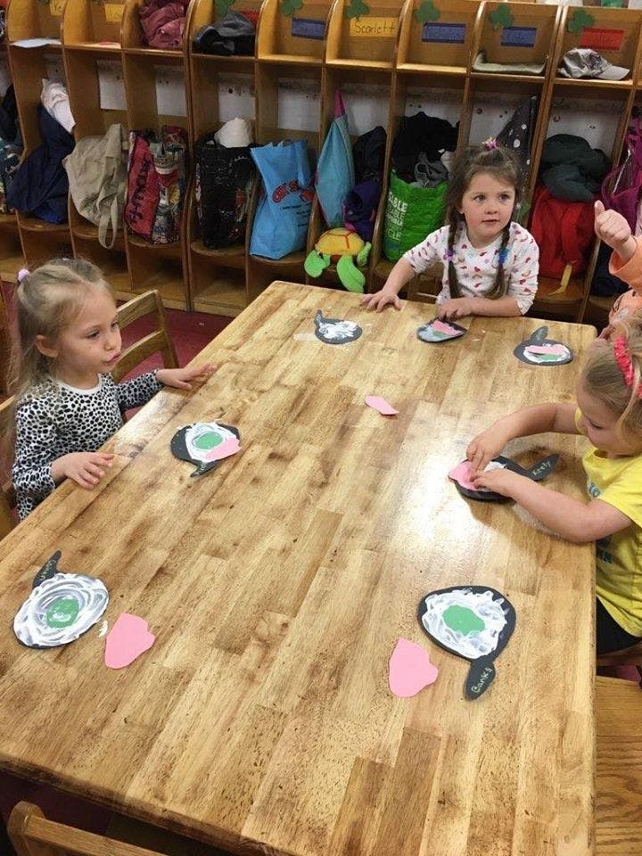 Children doing crafts at a table