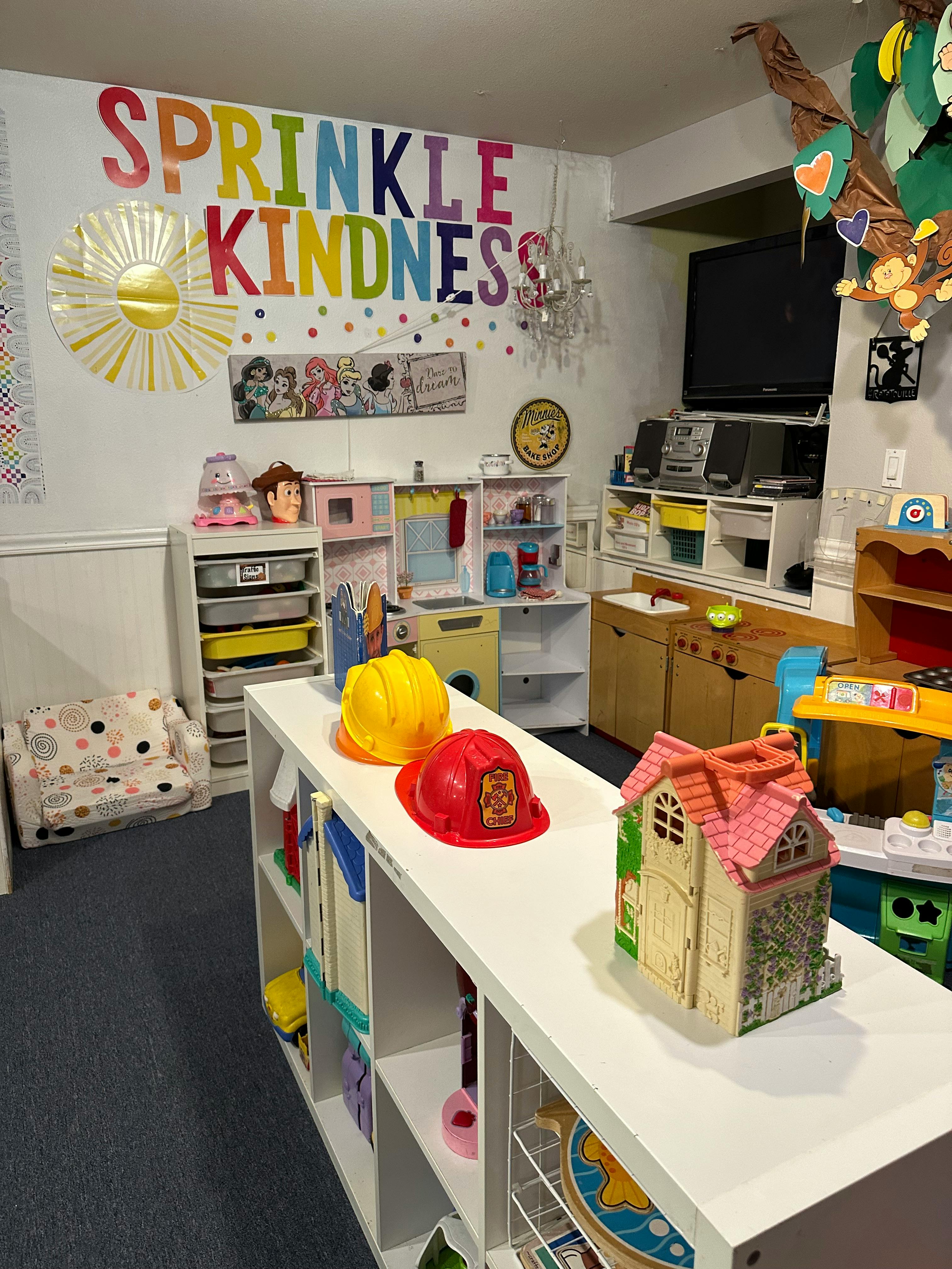 Playroom with a sign that says "Sprinkle Kindness"