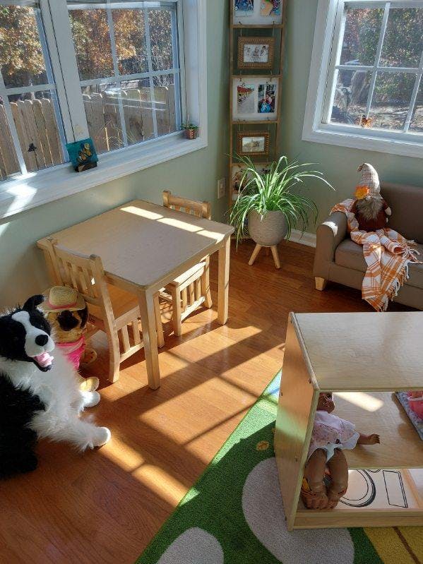 Children's table and chairs in a sunlit room