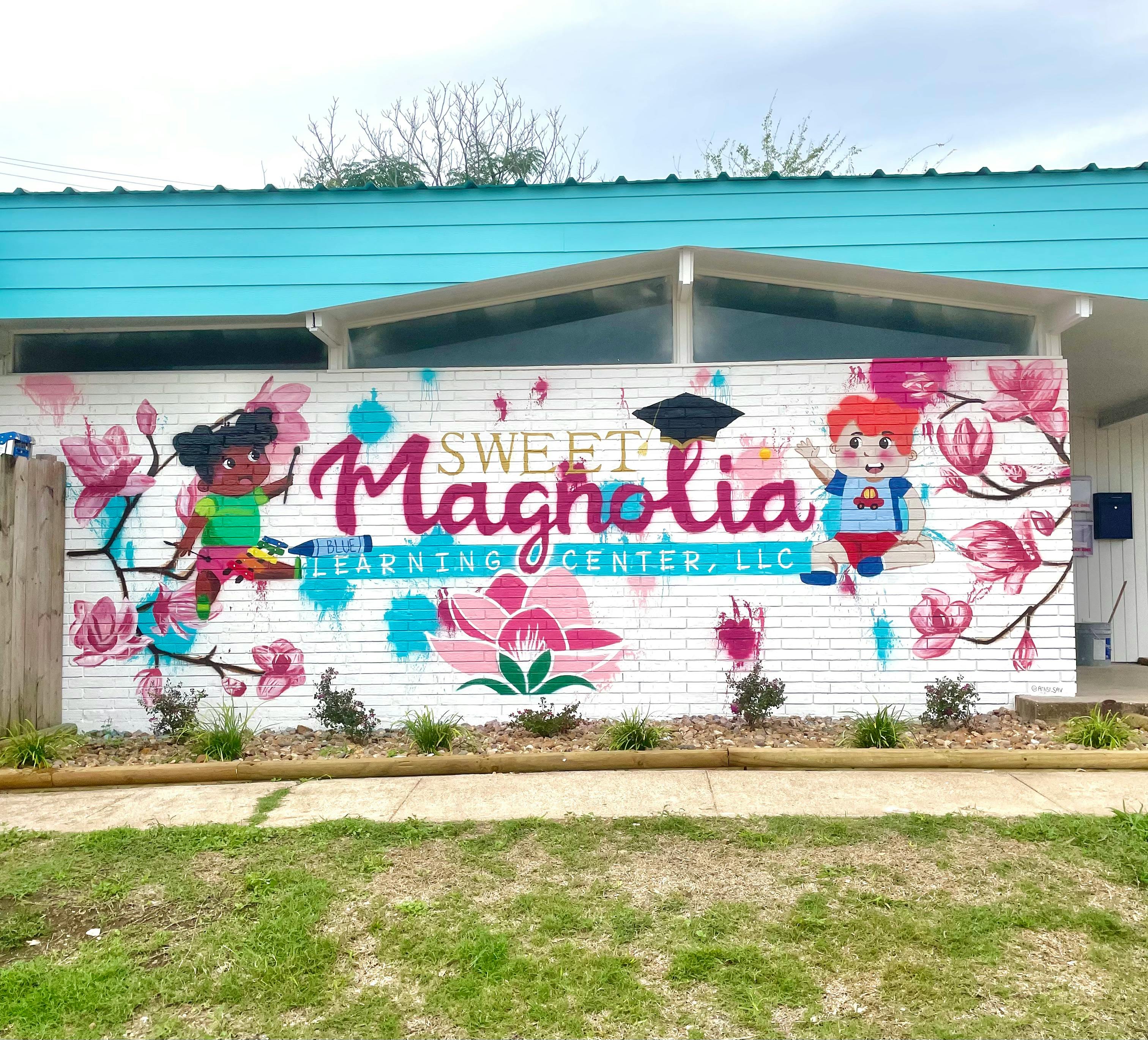 Mural on a building with "Sweet Magnolia Learning Center" and cartoon children