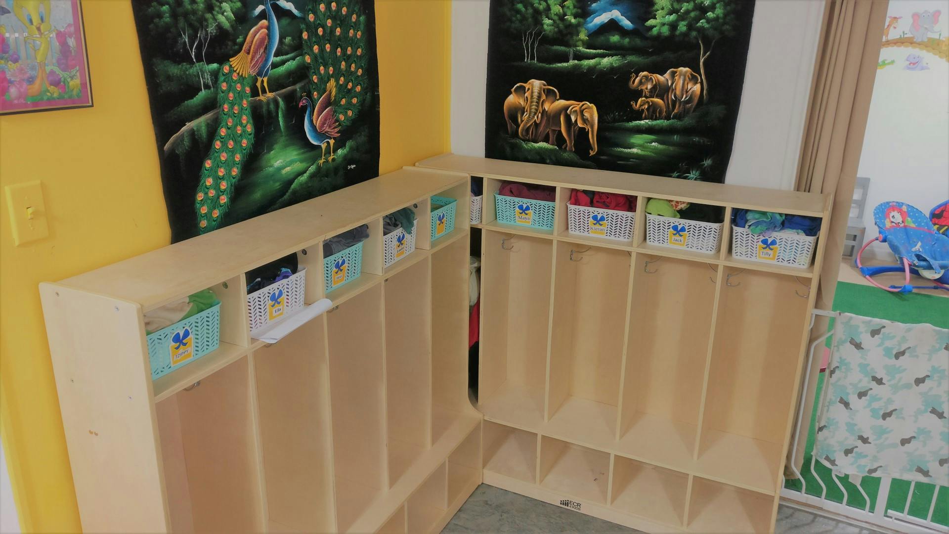 Wooden cubbies with storage bins in a classroom