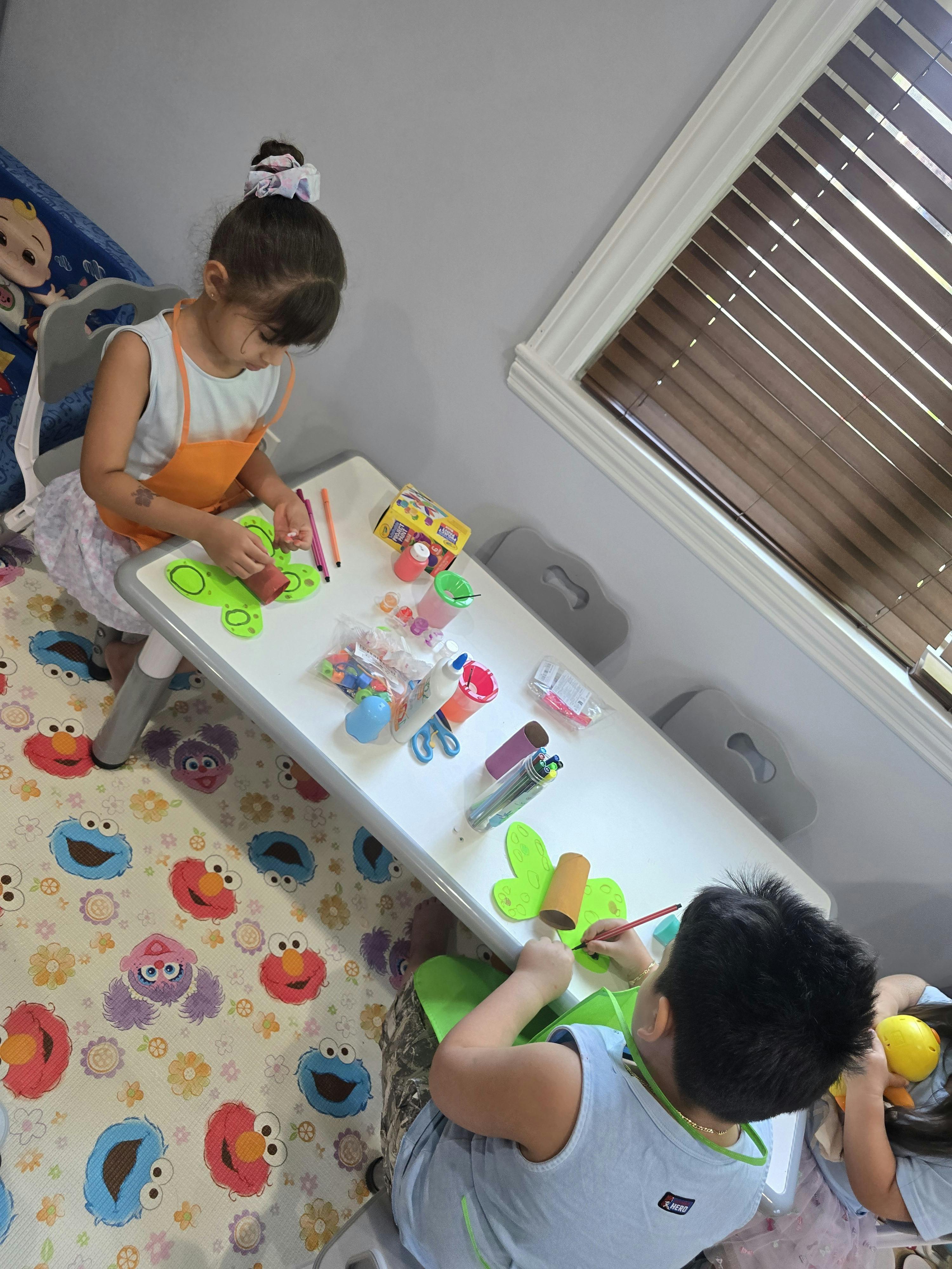 Children doing arts and crafts at a table