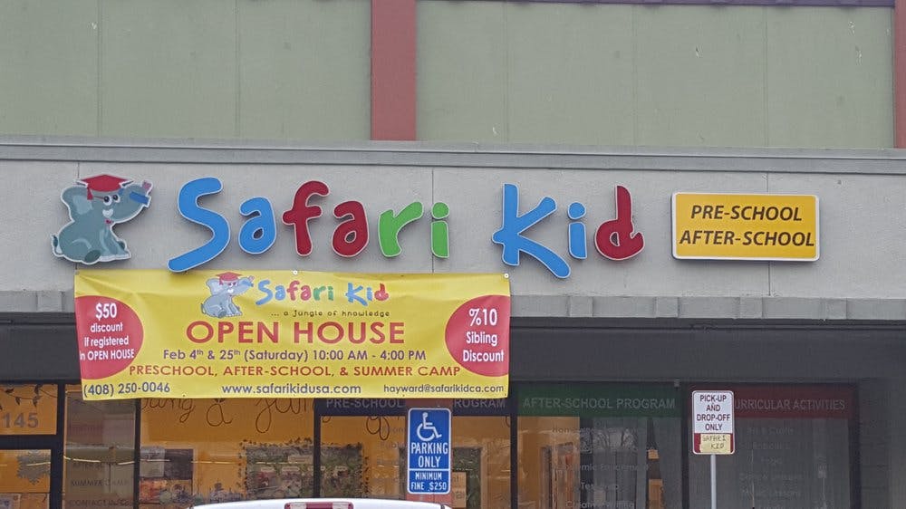 Safari Kid sign with "Open House" banner and "Pre-School After-School" sign