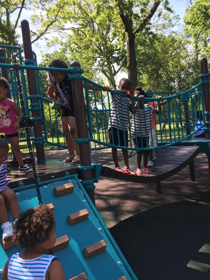Children playing on a playground structure