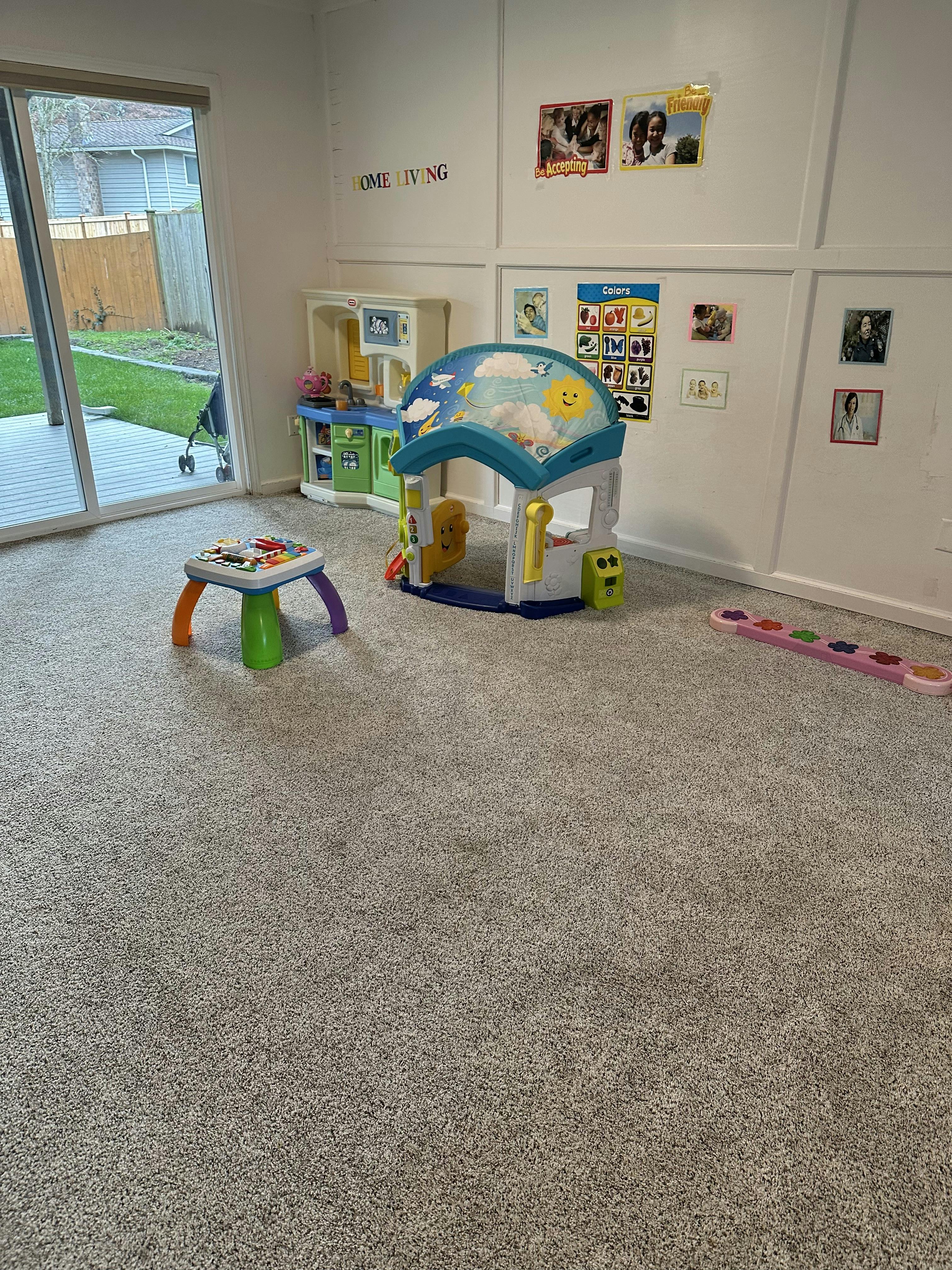 Playroom with toys and sliding glass door