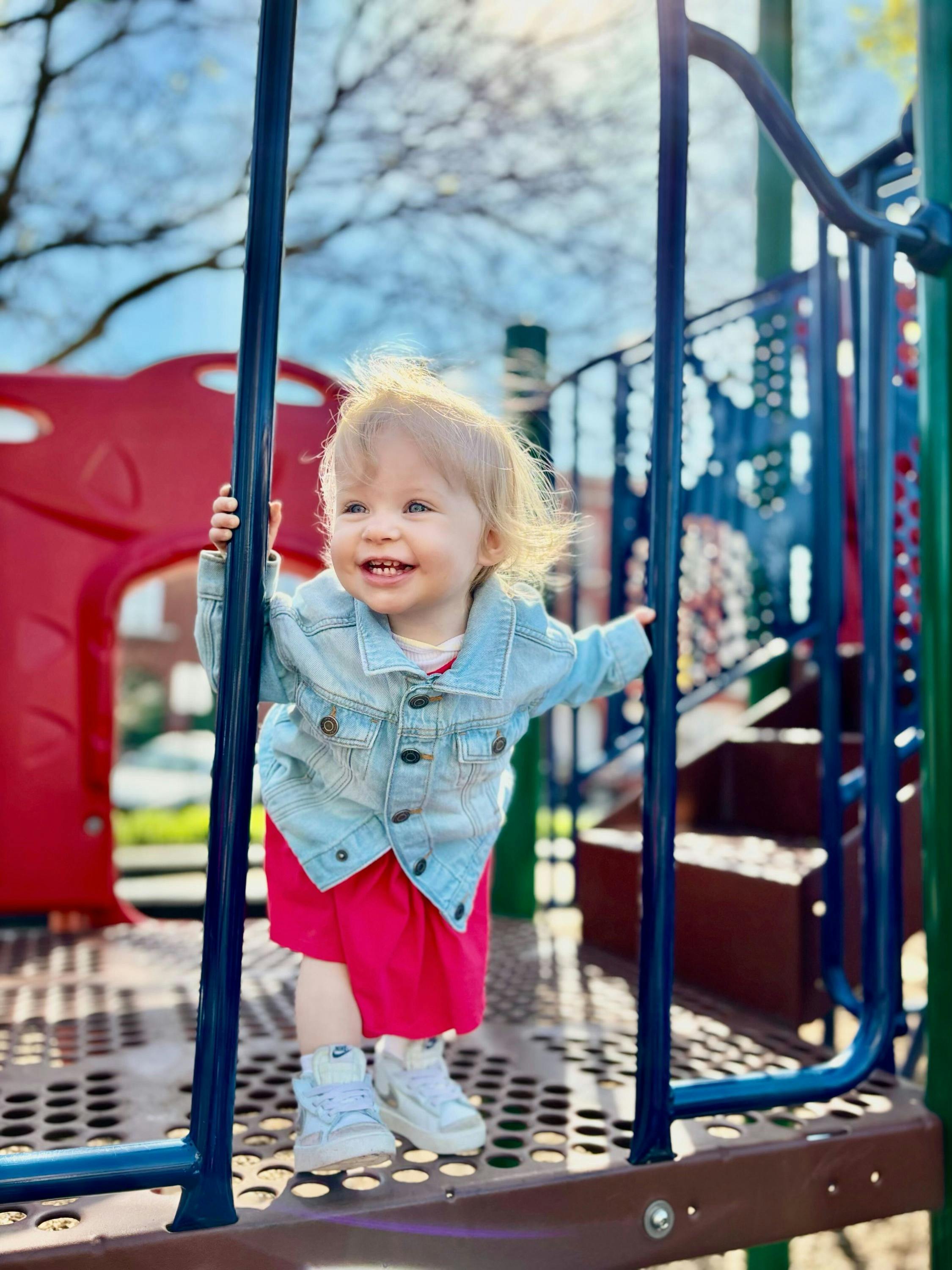 Child standing on a playground structure
