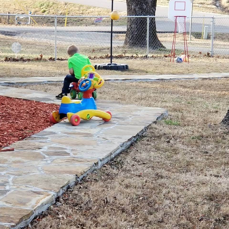Child on a ride-on toy outdoors
