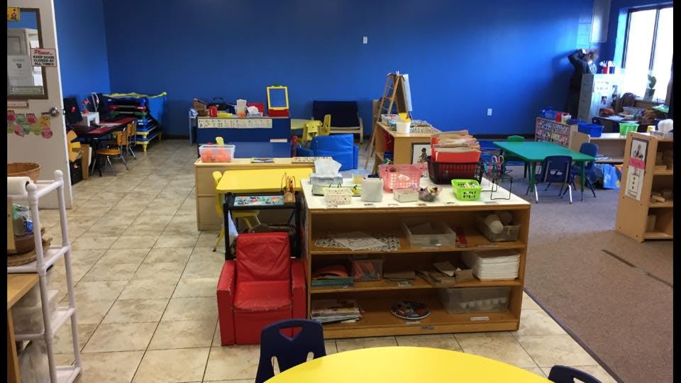 Classroom with blue walls and various learning materials