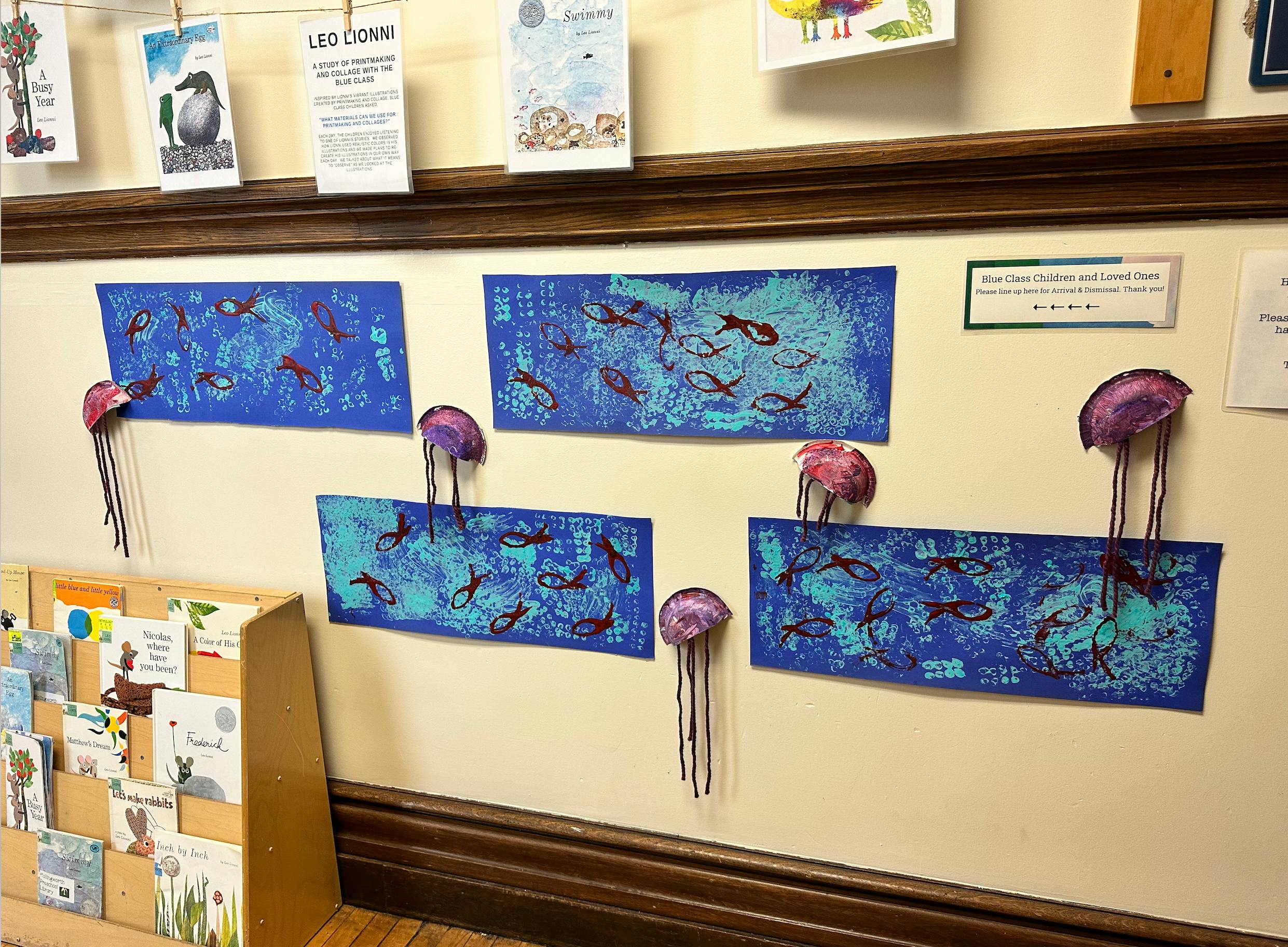Wall display with blue artwork depicting fish and purple jellyfish decorations